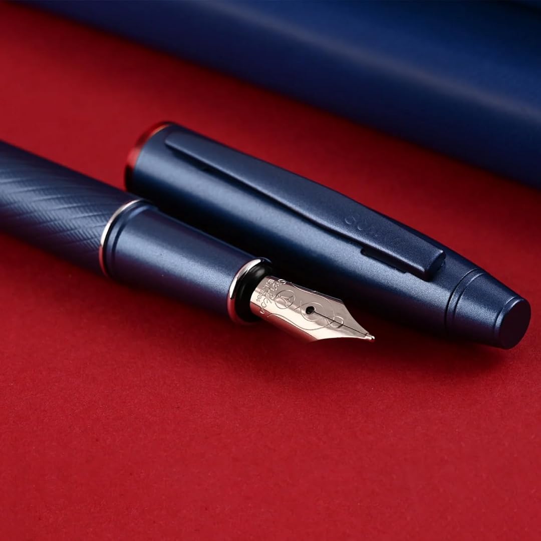 Scrikss Noble 35 Medium nib Blue Fountain Pen on a red surface
