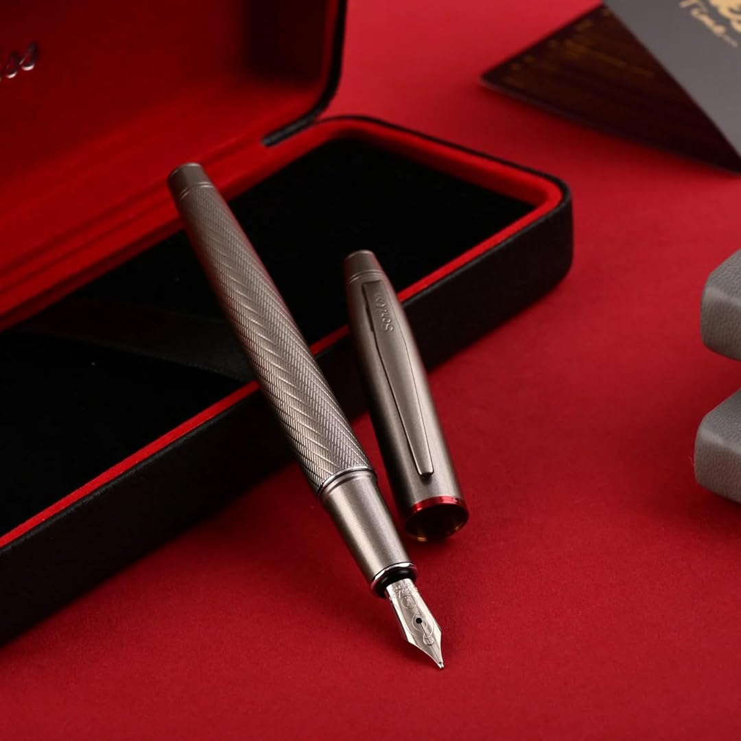Scrikss Noble 35 Medium nib Fountain Pen in Matte Titanium on a red and black open box