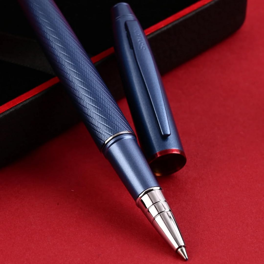Scrikss Noble 35 Rollerball Pen - Blue on a red surface