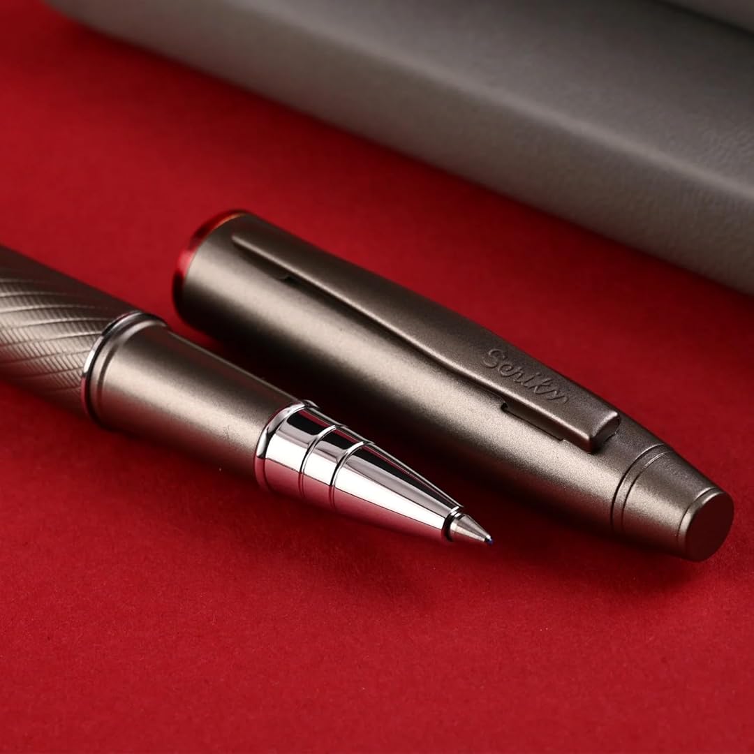 Scrikss Noble 35 Rollerball Pen in Matte Titanium on a red surface showing pen and pen cap side by side
